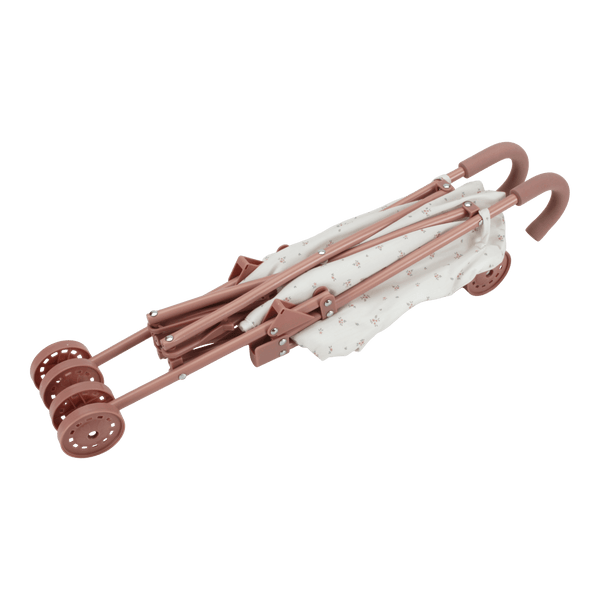Folded Little Dutch metal doll stroller in charming design, perfect for imaginative play and easy storage.