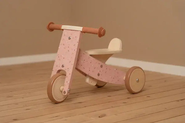 Little Dutch wooden pink tricycle for children, adjustable seat for comfort and safety, perfect for motor skill development.