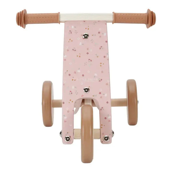 Pink wooden tricycle from Little Dutch, featuring adjustable seat and rubber grip handlebars for safety and comfort.