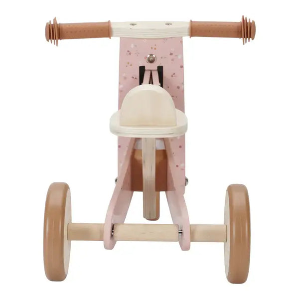 Little Dutch wooden pink tricycle with adjustable seat, rubber grips, and sturdy wheels for kids.