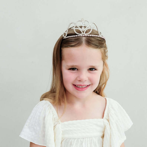 Mimi & Lula, Classic Princess Tiara worn by a smiling girl in a white dress, perfect for special occasions.