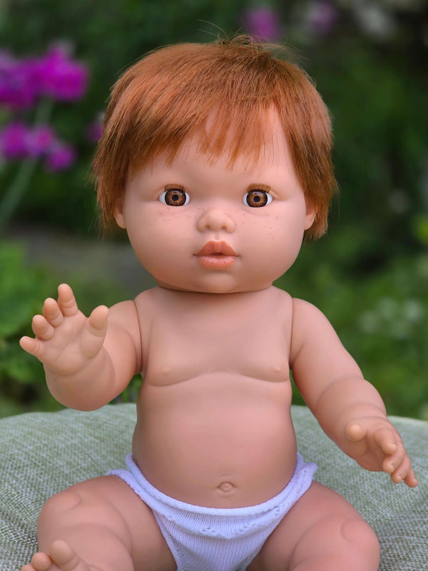 Mini Colettos, Jasper (Boy Doll with Brown Eyes & Red Hair) greeting with his hand, showcasing his cheerful expression.