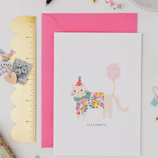 Cute cat birthday card with floral design, pink envelope, and "Let's Party!" text for festive celebrations.