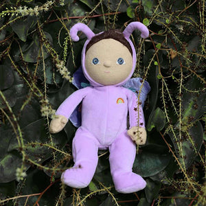 Olli Ella Dinky Dinkum Doll Betty Butterfly with purple wings on greenery.