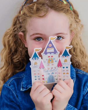 Mimi & Lula, Rainbow Castle Stick On Earrings displayed by a girl with curly hair, showcasing colorful designs.
