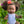 Dolls Vest and Pants Set in White displayed on Mini Colettos doll in floral garden.