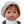 Mini Colettos, Jasper (Boy Doll with Brown Eyes & Red Hair) wearing a light cap and a playful expression.