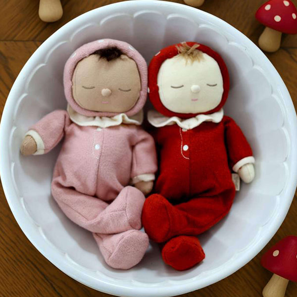 Two charming Olli Ella Dozy Dinkum dolls in cozy pajamas resting in a white bowl, perfect for cuddles and imaginative play.