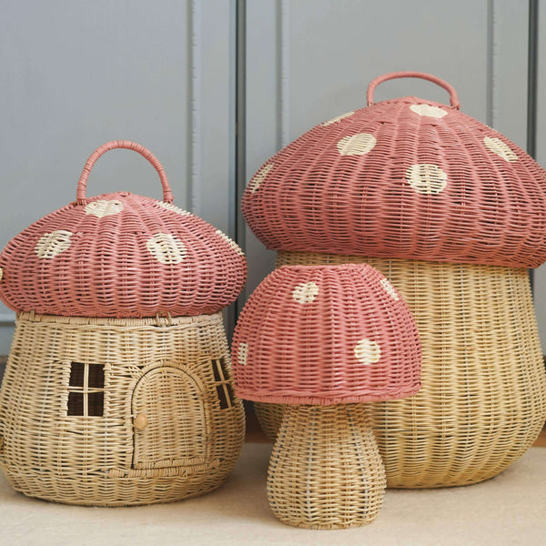 Set of whimsical wicker mushroom baskets in natural tones with pink tops, perfect for organizing and adding charm to any room.