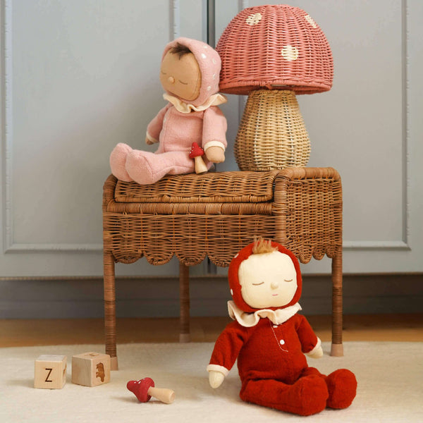 Cozy nursery scene featuring Olli Ella's Toadstool Lamp in Musk, with adorable dolls and wooden blocks.