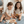 Two toddlers joyfully playing with the Speedy Monkey, Garden Surprise Puzzle, unveiling colorful wooden animals.