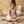 A joyful child playing with Speedy Monkey, Stringable Beads on the floor, enhancing fine motor skills.