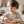 Happy child playing with Speedy Monkey, Stringable Beads and lacing strings, enjoying hands-on exploration.