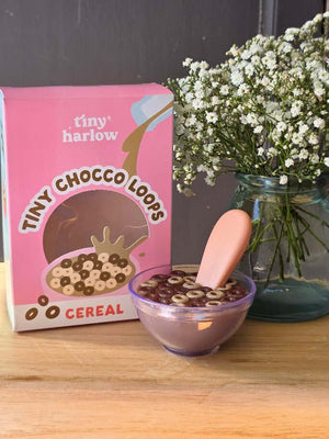 Tiny Harlow Tiny Choco Loops cereal bowl with chocolate milk and loops next to the cereal box, perfect doll accessory.