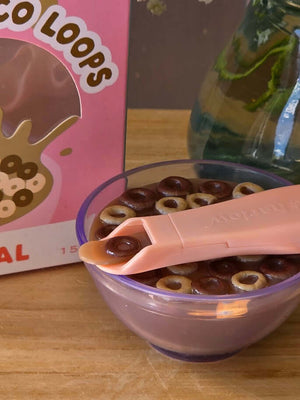 Tiny Harlow Tiny Tiny Choco Loops Cereal Bowl with chocolate milk and a spoon, perfect for doll playtime.