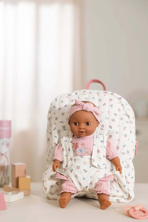 Little Dutch, Doll Carrier featuring a charming doll in a pink outfit and floral backpack.